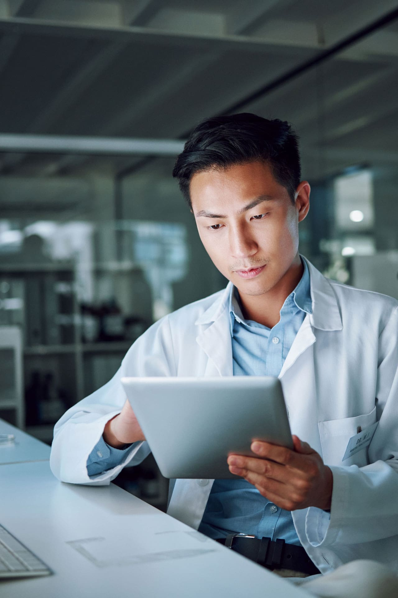 male doctor looking at a laptop