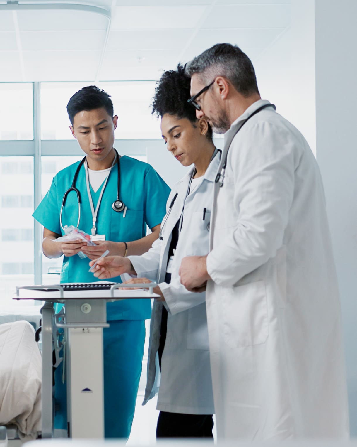 group of medical personnels looking at records