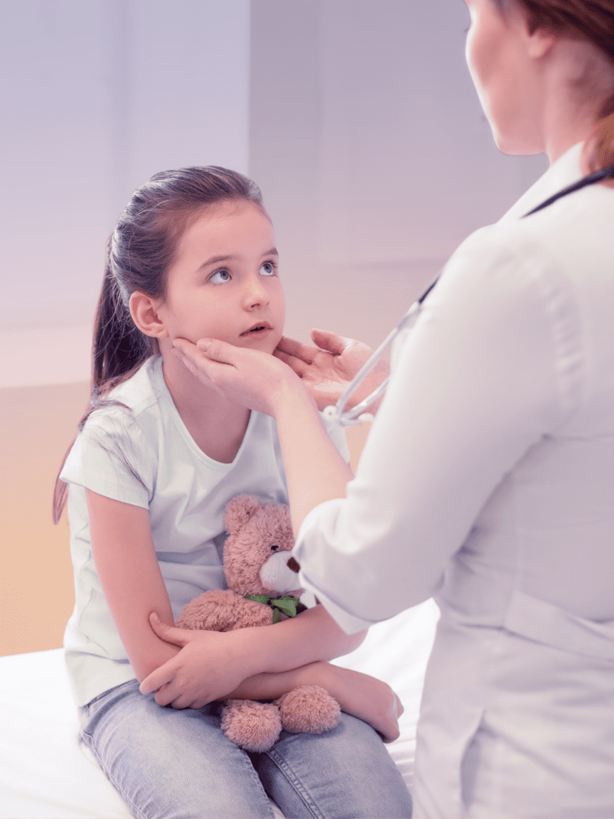 physician checking a young patient